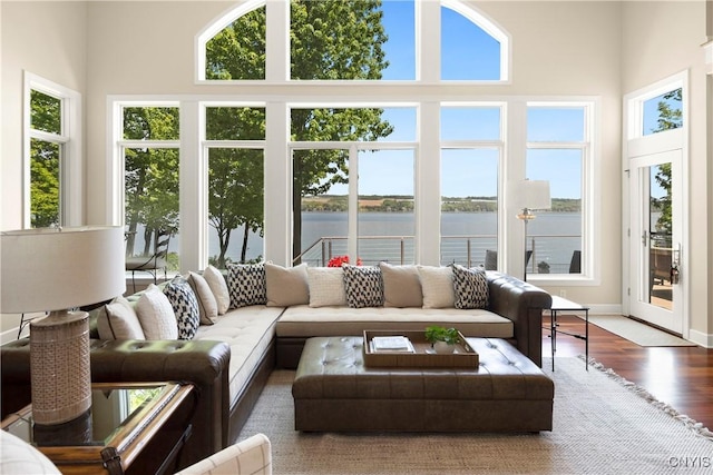 sunroom / solarium with a water view