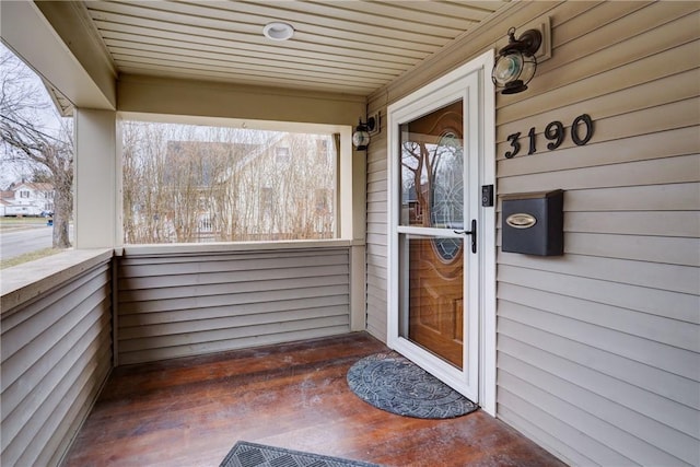 property entrance featuring covered porch