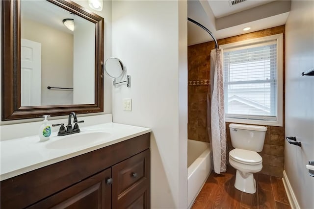 full bathroom featuring shower / tub combo, toilet, wood finished floors, and vanity