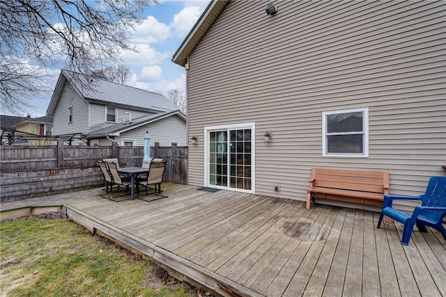 wooden deck featuring outdoor dining area and fence