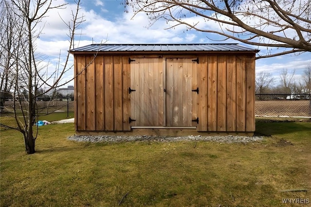 view of shed with fence