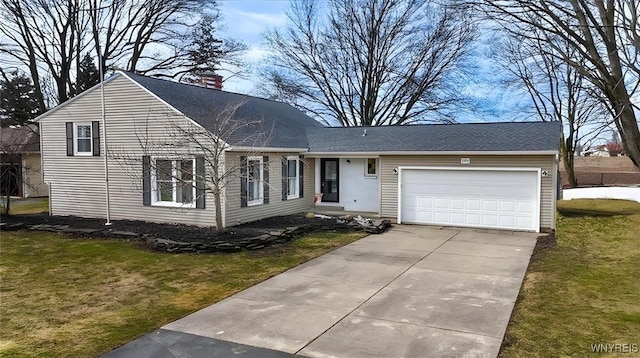 view of front facade with a garage, concrete driveway, and a front yard