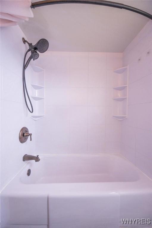 bathroom with shower / bathtub combination