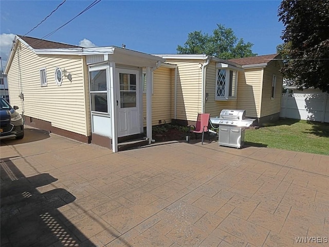 exterior space with a patio area and fence