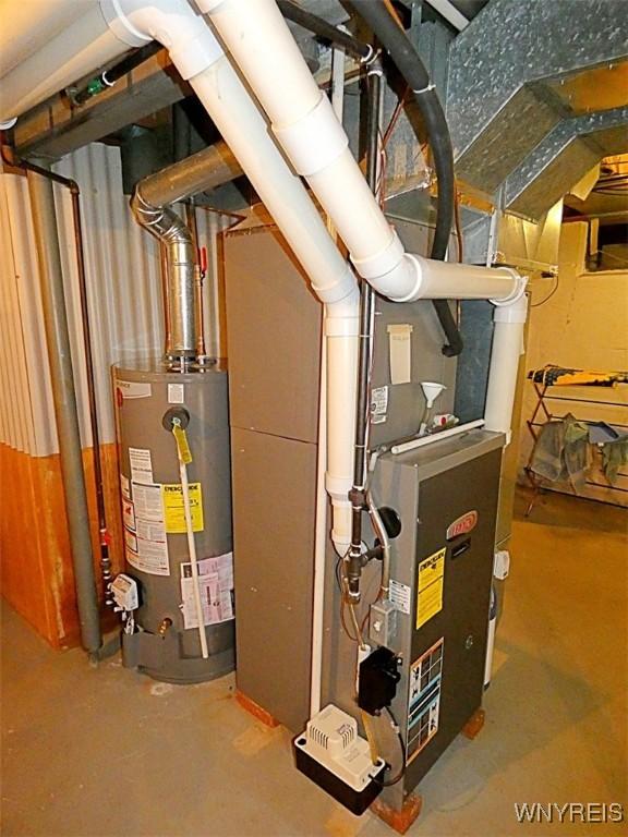 utility room with gas water heater