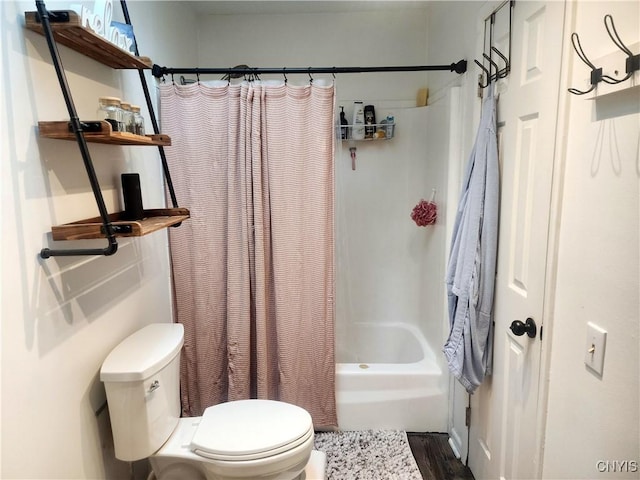 full bathroom featuring toilet and shower / bathtub combination with curtain