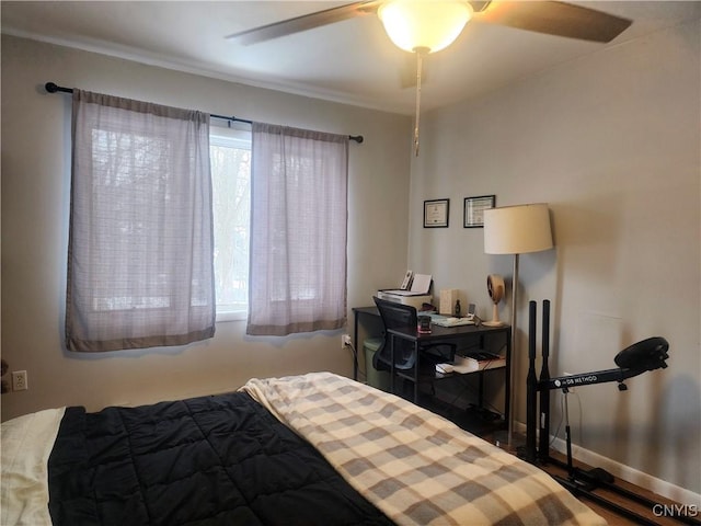 bedroom featuring a ceiling fan and baseboards