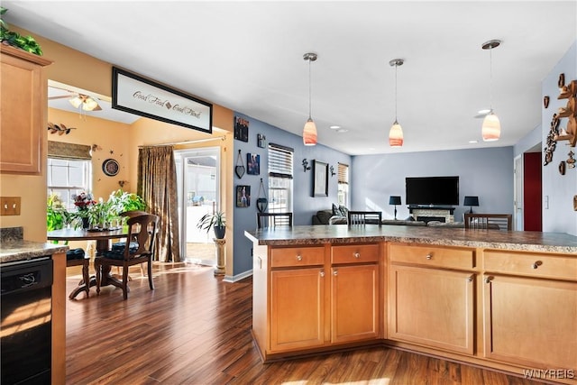 kitchen with dark countertops, open floor plan, dishwasher, hanging light fixtures, and dark wood-style floors