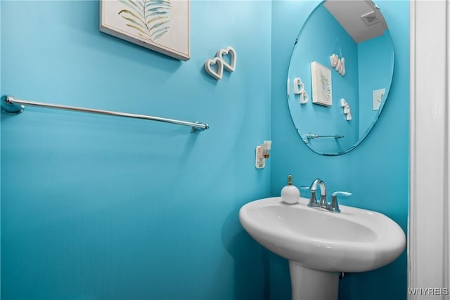 bathroom with visible vents and a sink