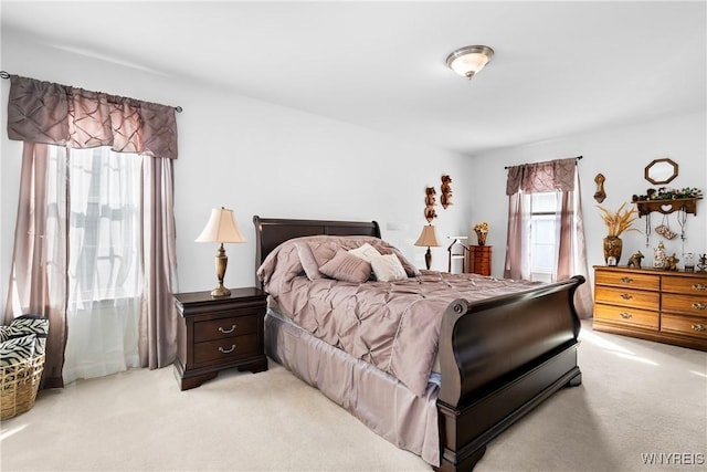 bedroom featuring light colored carpet