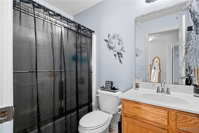 full bathroom featuring vanity and toilet