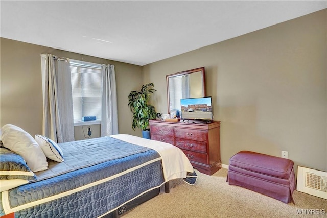 carpeted bedroom featuring visible vents and multiple windows