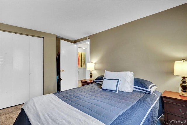 carpeted bedroom with a closet