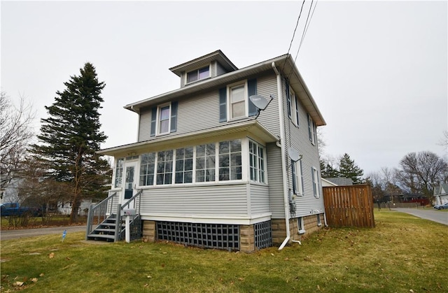 view of front of home with a front yard and entry steps