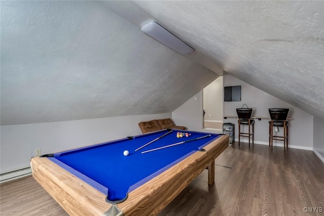 playroom featuring a textured ceiling, lofted ceiling, and wood finished floors