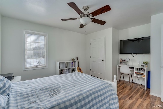 bedroom featuring ceiling fan and wood finished floors