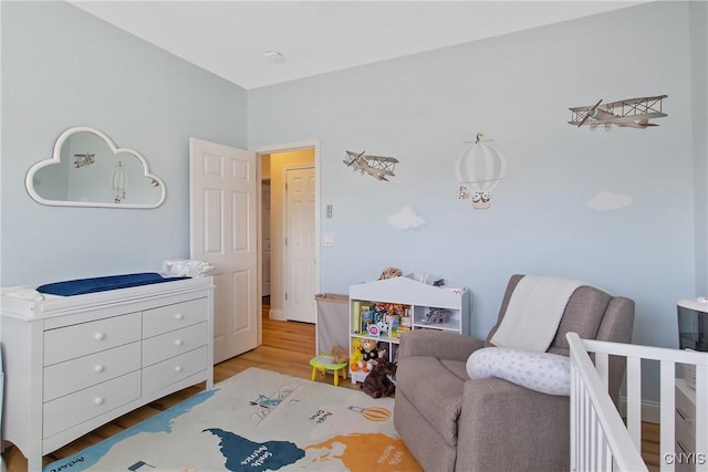 bedroom with wood finished floors