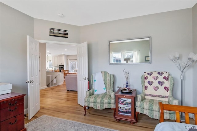 living area with light wood-style floors