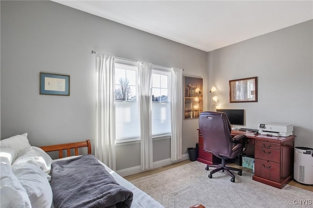 office with baseboards and wood finished floors