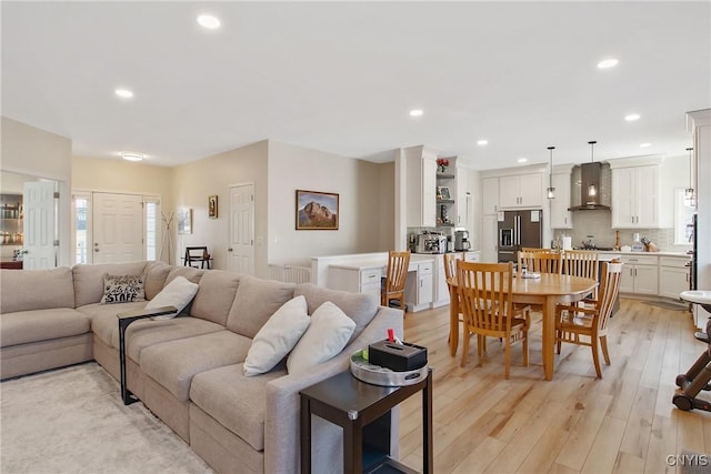 living room featuring recessed lighting and light wood finished floors