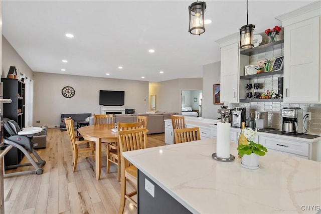 dining area featuring recessed lighting and light wood finished floors