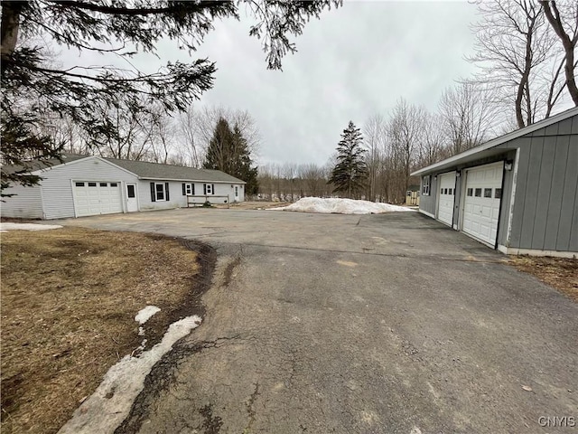 view of street featuring aphalt driveway