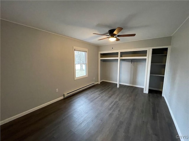 unfurnished bedroom featuring ornamental molding, a baseboard heating unit, baseboards, ceiling fan, and dark wood-style flooring