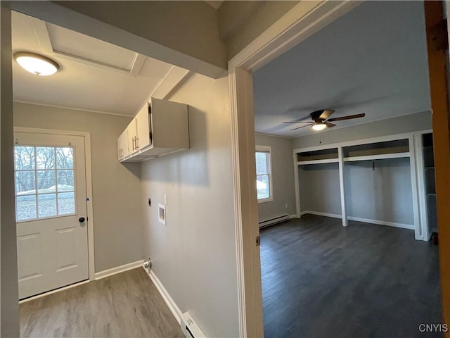 laundry area with a ceiling fan, cabinet space, a baseboard radiator, hookup for a washing machine, and dark wood-style flooring