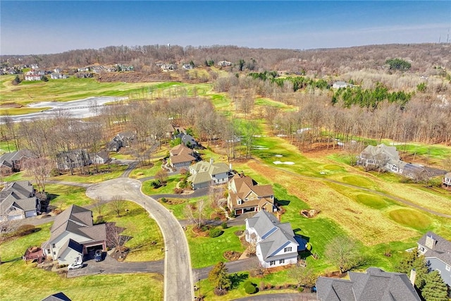 aerial view with a residential view and view of golf course