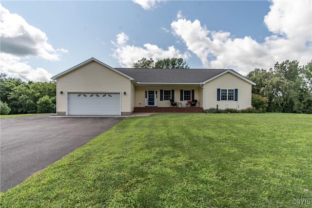 ranch-style house featuring a front yard, a porch, a garage, and driveway