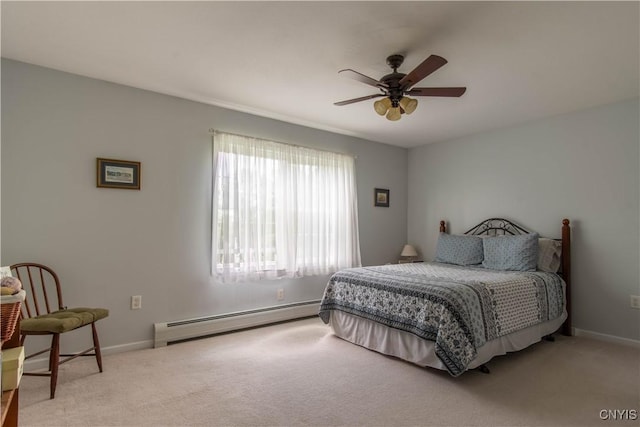 bedroom with carpet flooring, a ceiling fan, baseboards, and a baseboard radiator