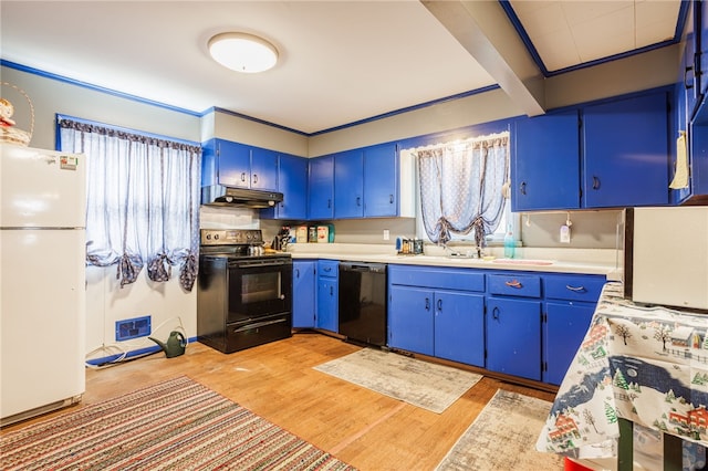 kitchen with black appliances, blue cabinetry, under cabinet range hood, and a sink