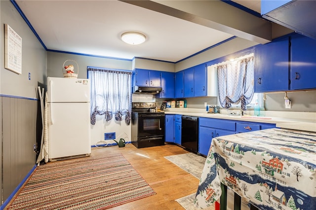 kitchen featuring black appliances, blue cabinetry, light countertops, and under cabinet range hood