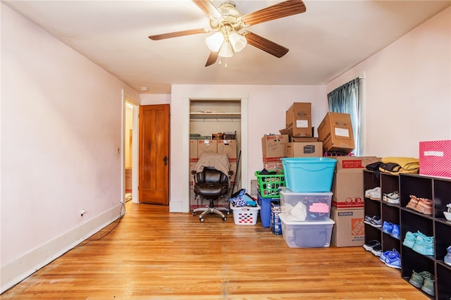 storage room with a ceiling fan