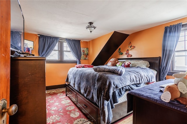 bedroom featuring baseboards