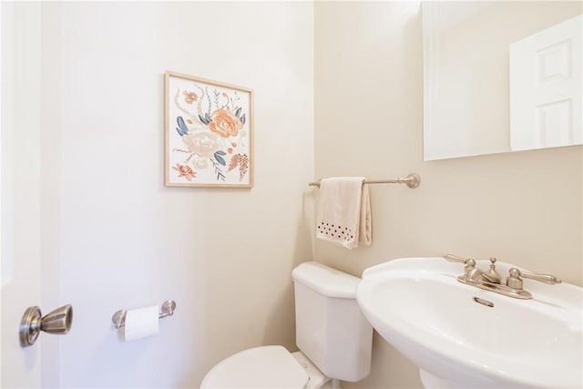 bathroom featuring a sink and toilet