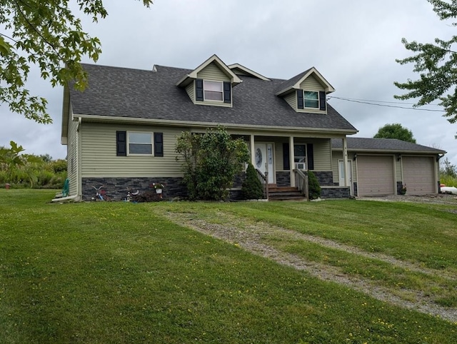 cape cod house with driveway, an attached garage, a front lawn, and a shingled roof