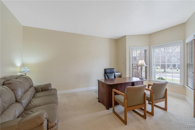 office space with light carpet and baseboards