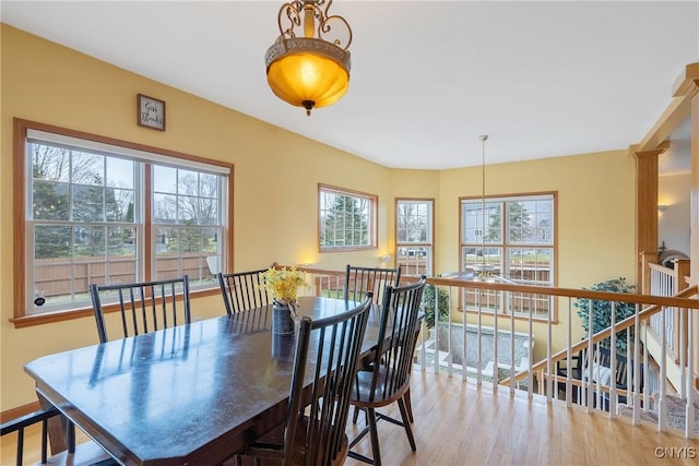 dining area with wood finished floors