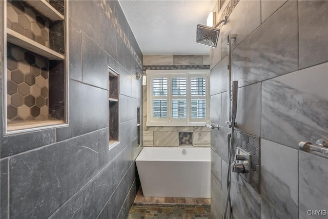 bathroom featuring tiled shower, tile walls, and a tub to relax in