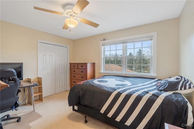 bedroom featuring a closet, carpet flooring, and a ceiling fan