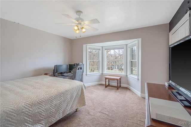 bedroom with carpet flooring, a ceiling fan, and baseboards