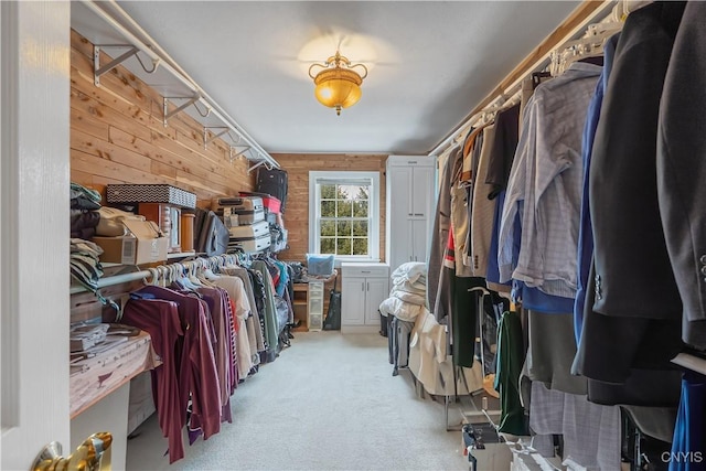 walk in closet with carpet flooring