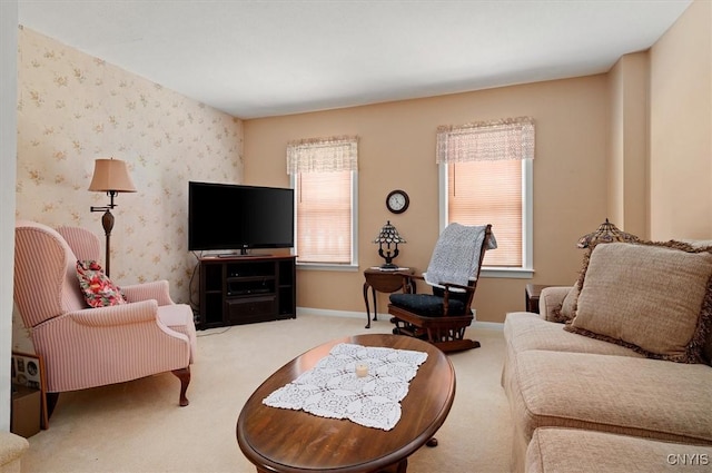 living room with baseboards, carpet floors, and wallpapered walls