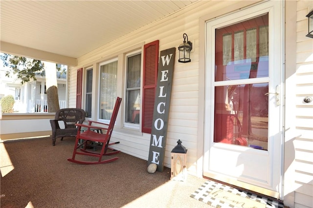 entrance to property featuring covered porch