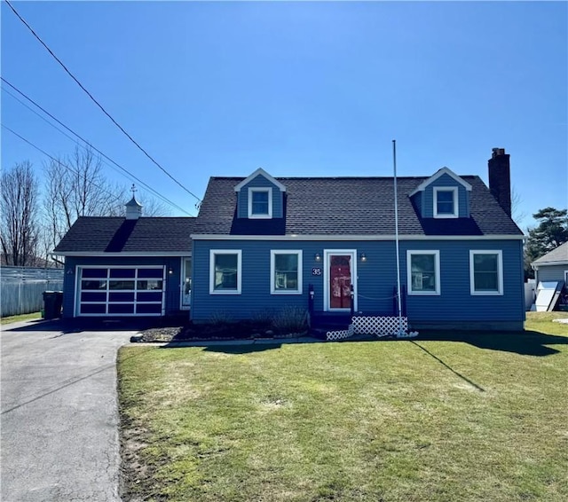 view of front of home with driveway, a front lawn, fence, an attached garage, and a chimney