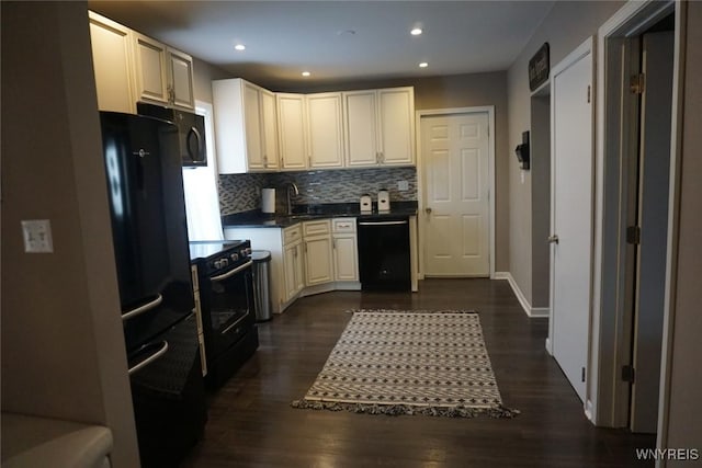 kitchen with tasteful backsplash, dark countertops, dark wood-type flooring, recessed lighting, and black appliances