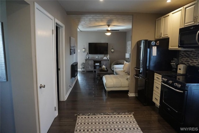 kitchen featuring dark wood finished floors, black appliances, baseboards, and tasteful backsplash