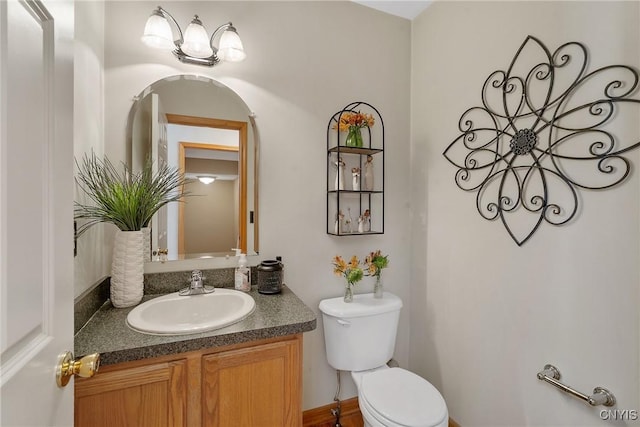 bathroom with toilet and vanity