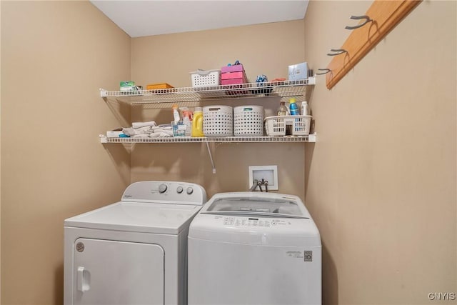 laundry area with separate washer and dryer and laundry area